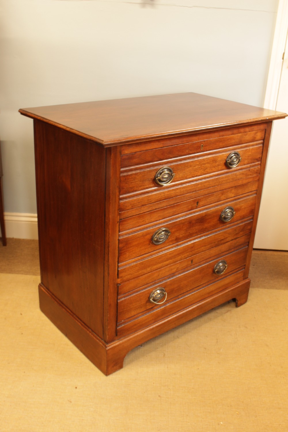 A Edwardian Walnut Chest Of Drawers  View IV