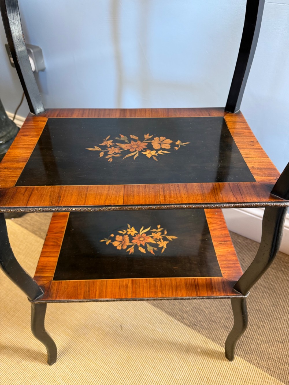 A three-tiered French ebonised walnut whatnot table with marquetry floral inlays, a single drawer, cabriole legs, and a pierced brass top gallery. View III
