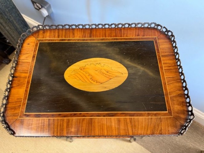 A three-tiered French ebonised walnut whatnot table with marquetry floral inlays, a single drawer, cabriole legs, and a pierced brass top gallery. View II