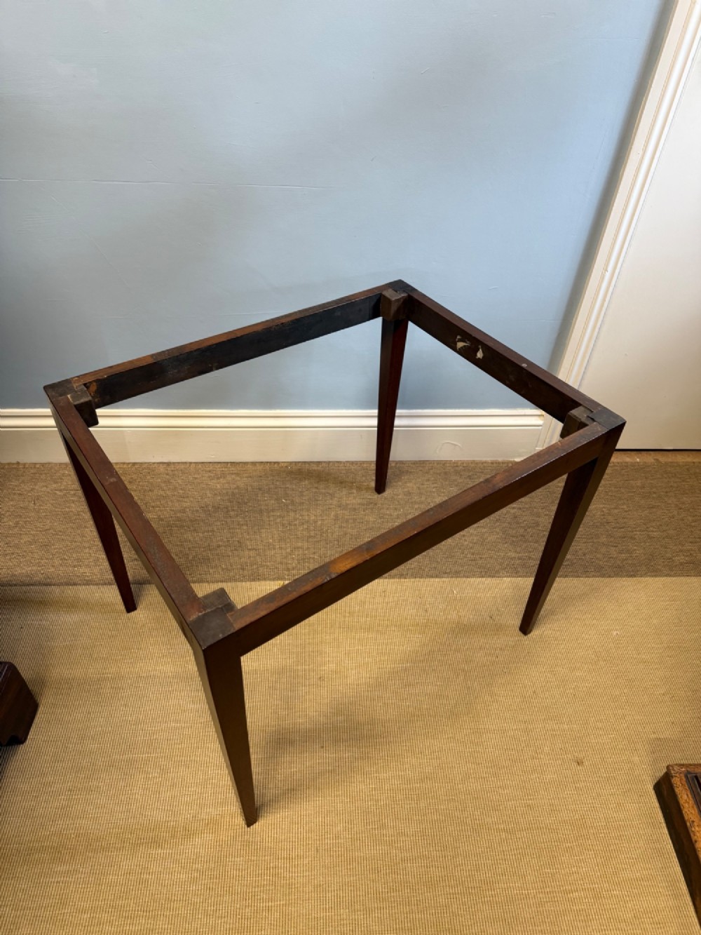 A late nineteenth-century mahogany tray top table featuring a pierced fretwork gallery, integrated cut-out side handles, and four square tapered legs. View IV