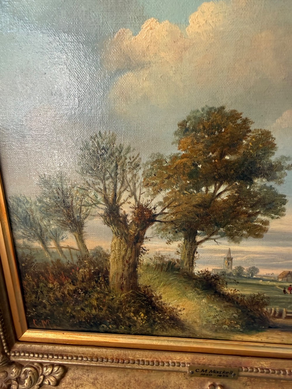 An antique Victorian oil painting on canvas depicting a rural English countryside scene set within an ornate gilded frame. View IV