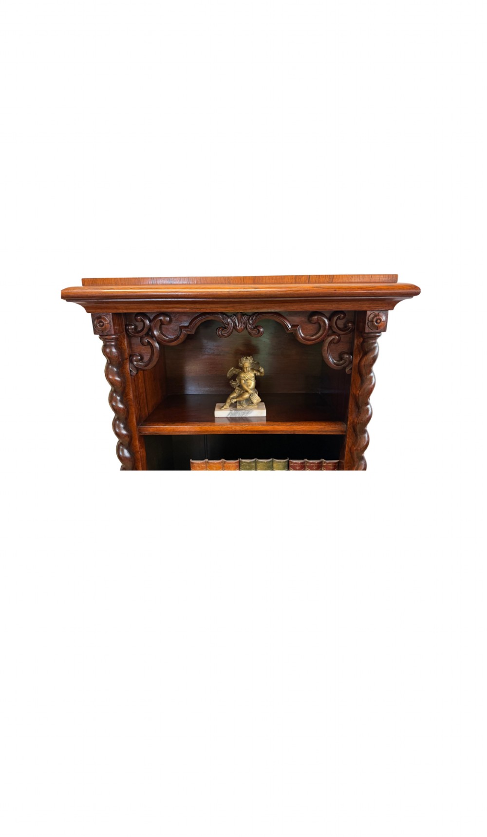 A 19th-century Victorian rosewood open bookcase featuring four open shelves flanked by barley twist pilasters and topped with carved scrollwork. View II