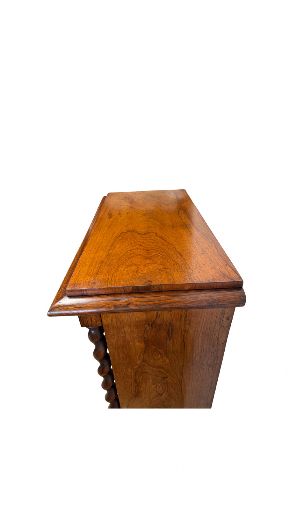 A 19th-century Victorian rosewood open bookcase featuring four open shelves flanked by barley twist pilasters and topped with carved scrollwork. View III