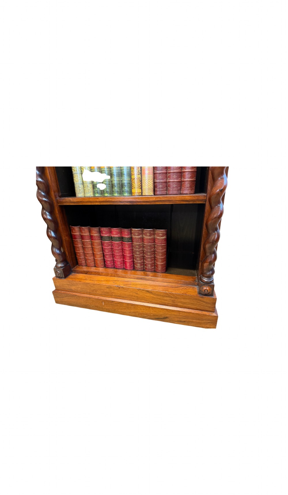 A 19th-century Victorian rosewood open bookcase featuring four open shelves flanked by barley twist pilasters and topped with carved scrollwork. View V