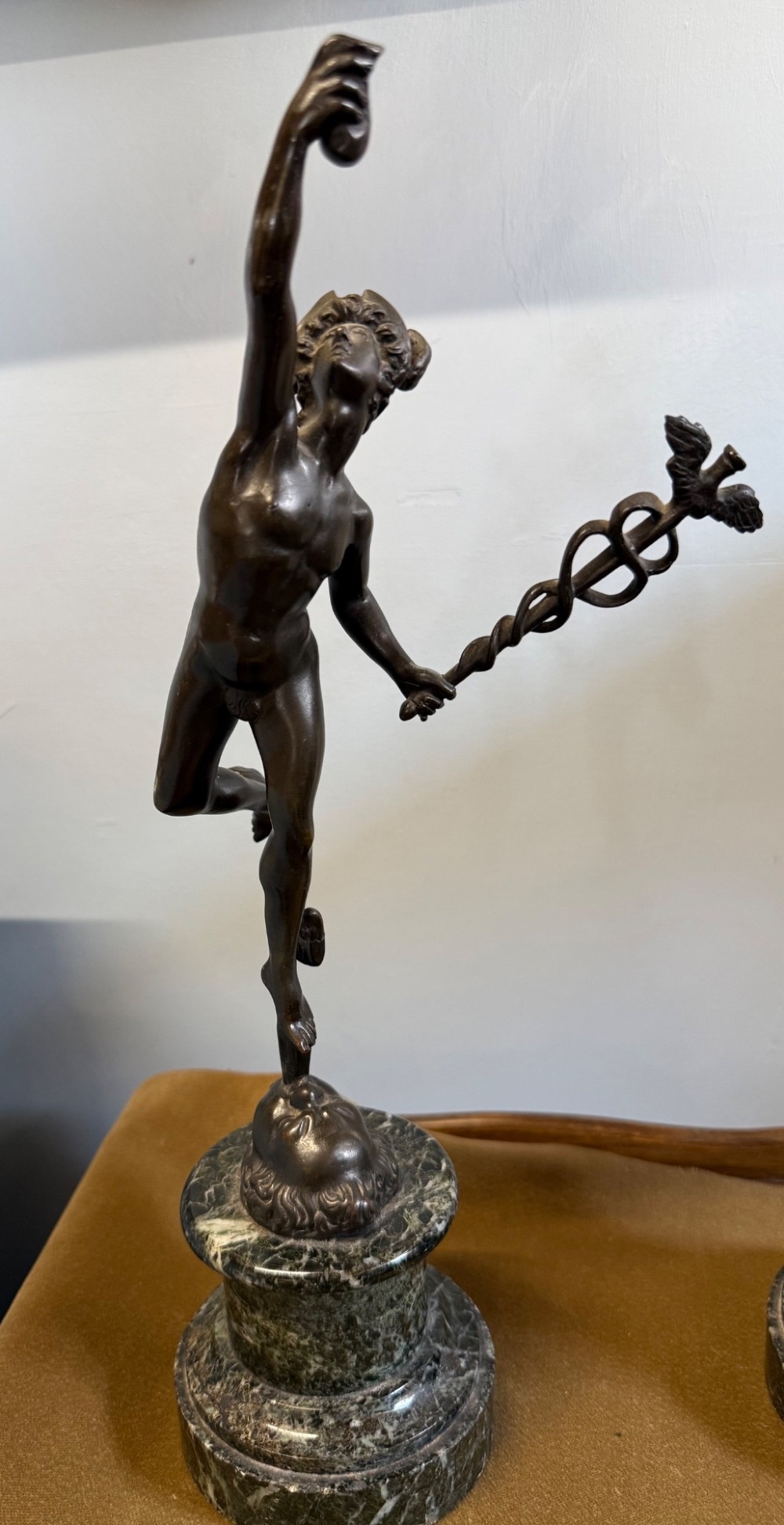 A pair of dark bronze Neoclassical figures depicting Mercury and Fortuna mounted on cylindrical green marble pedestals. View VI