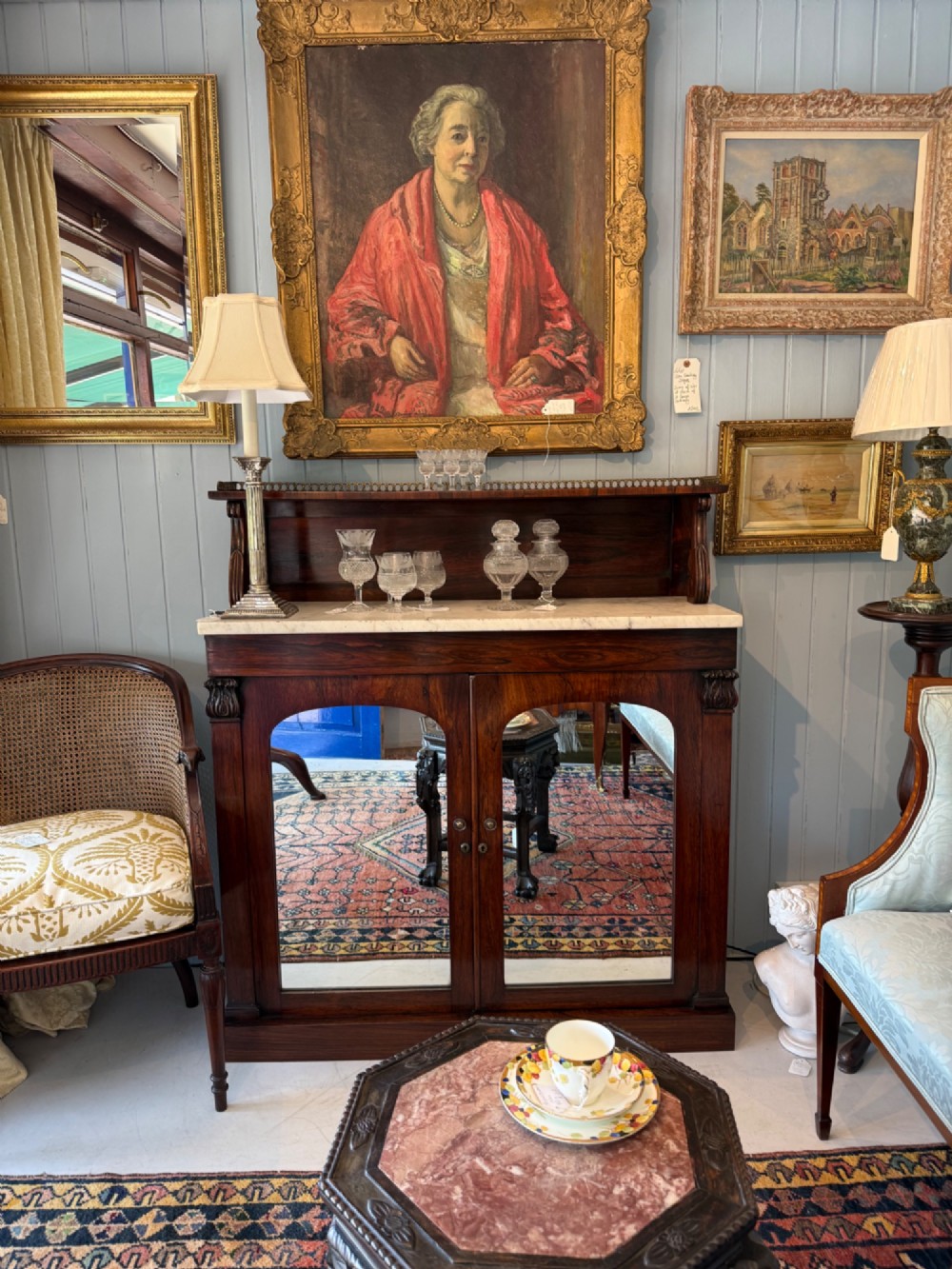 A nineteenth-century dark rosewood chiffonier featuring a white marble top surface, twin mirrored door panels, and a raised upper shelf with brass gallery detailing. View VII