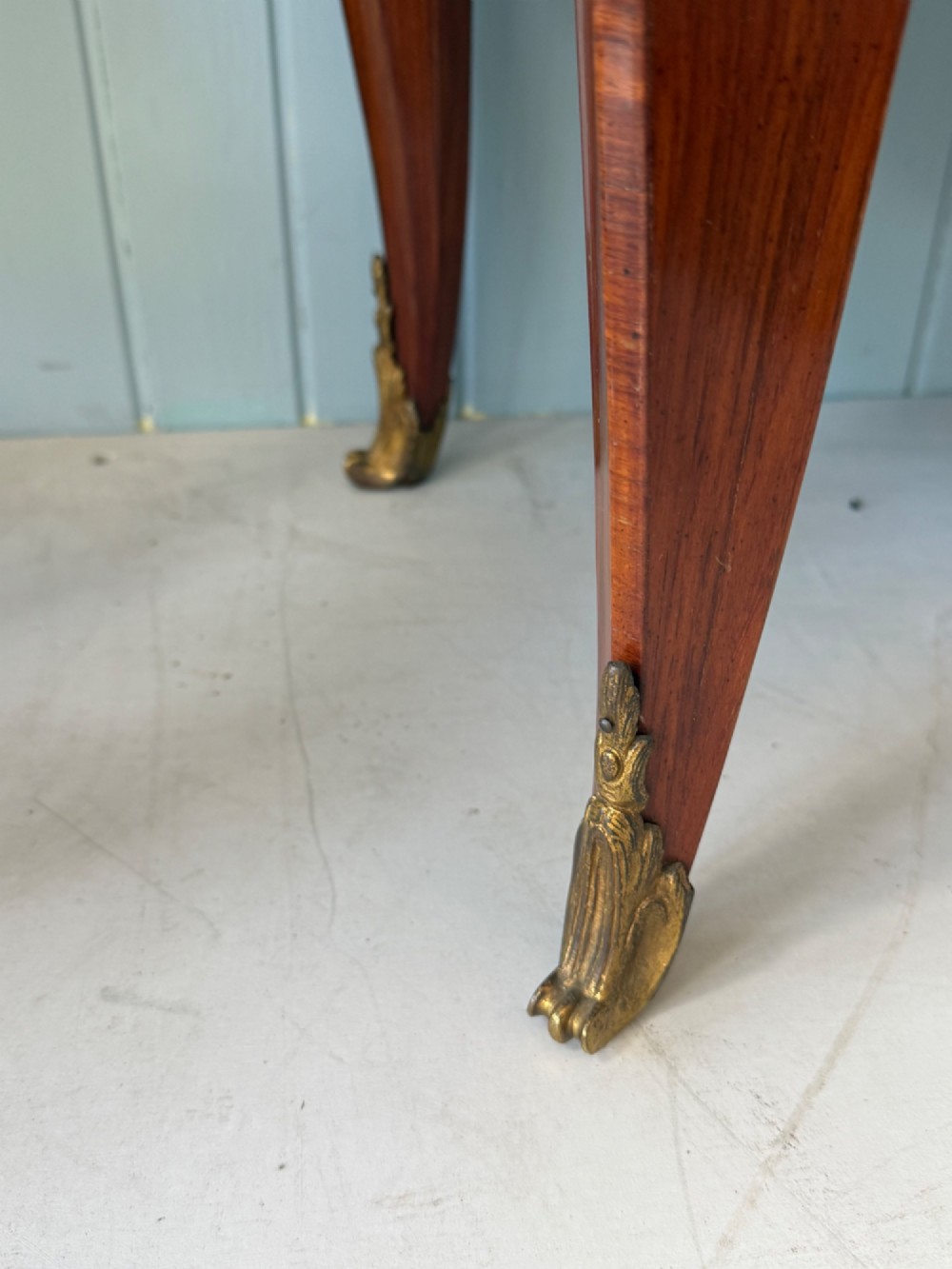 A mid 19th-century French commode featuring a marble top, parquetry wood veneer, two drawers with gilt bronze handles, and cabriole legs. View VIII