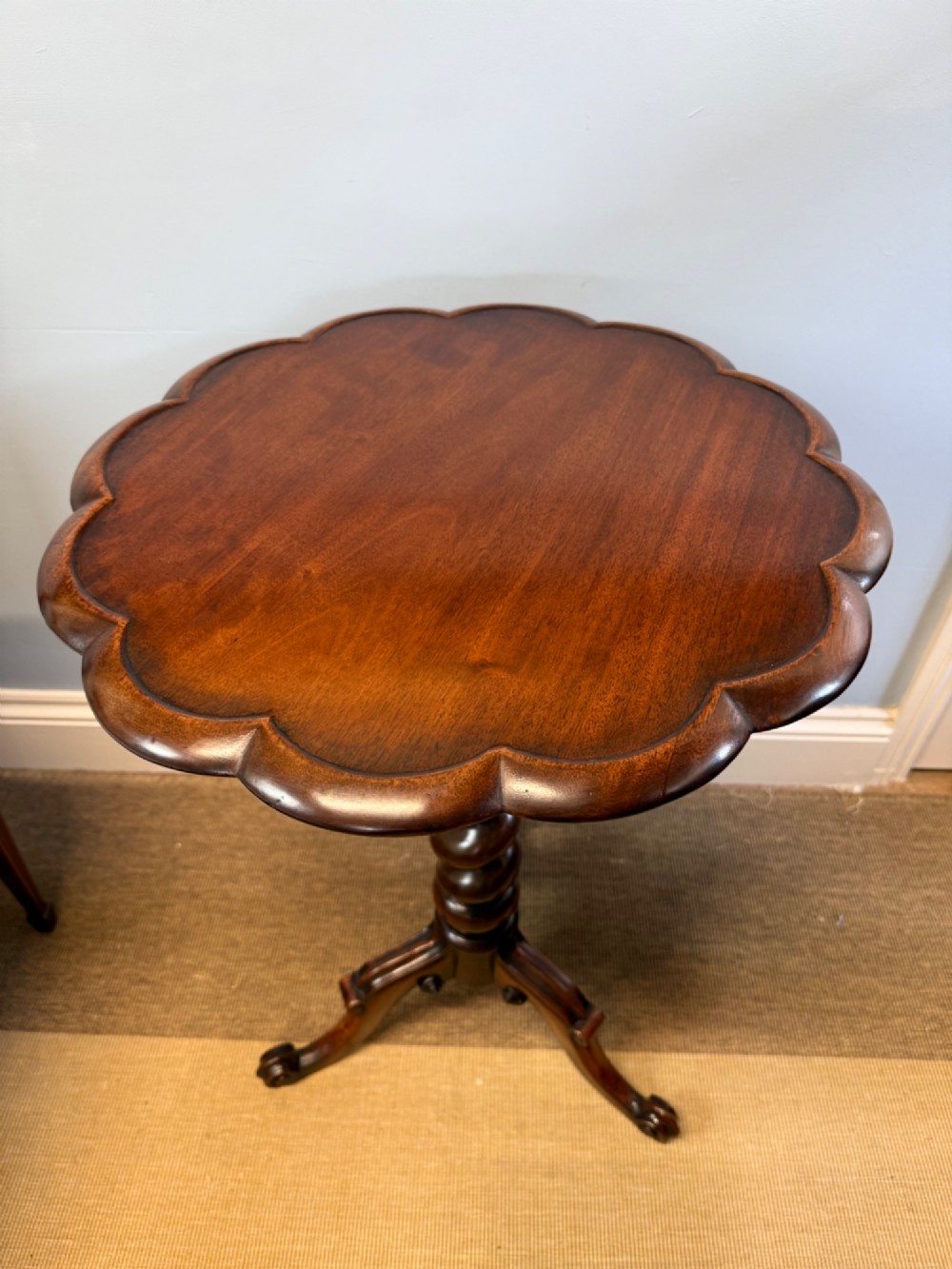 A 19th-century mahogany tripod side table featuring a scalloped piecrust edge top, a spiral barley twist column stem, and carved cabriole legs. View III