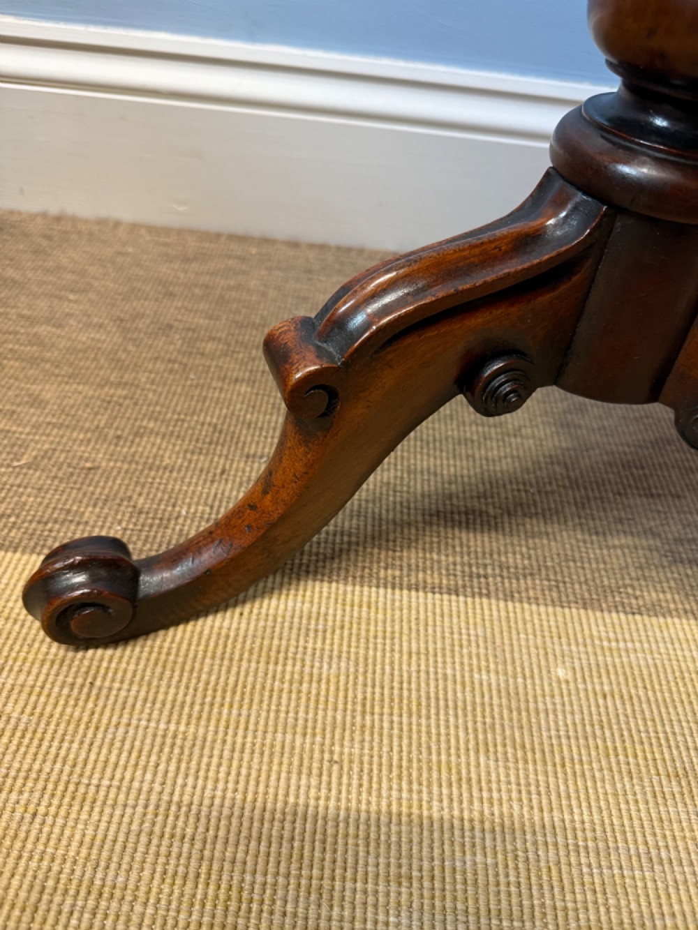 A 19th-century mahogany tripod side table featuring a scalloped piecrust edge top, a spiral barley twist column stem, and carved cabriole legs. View VII