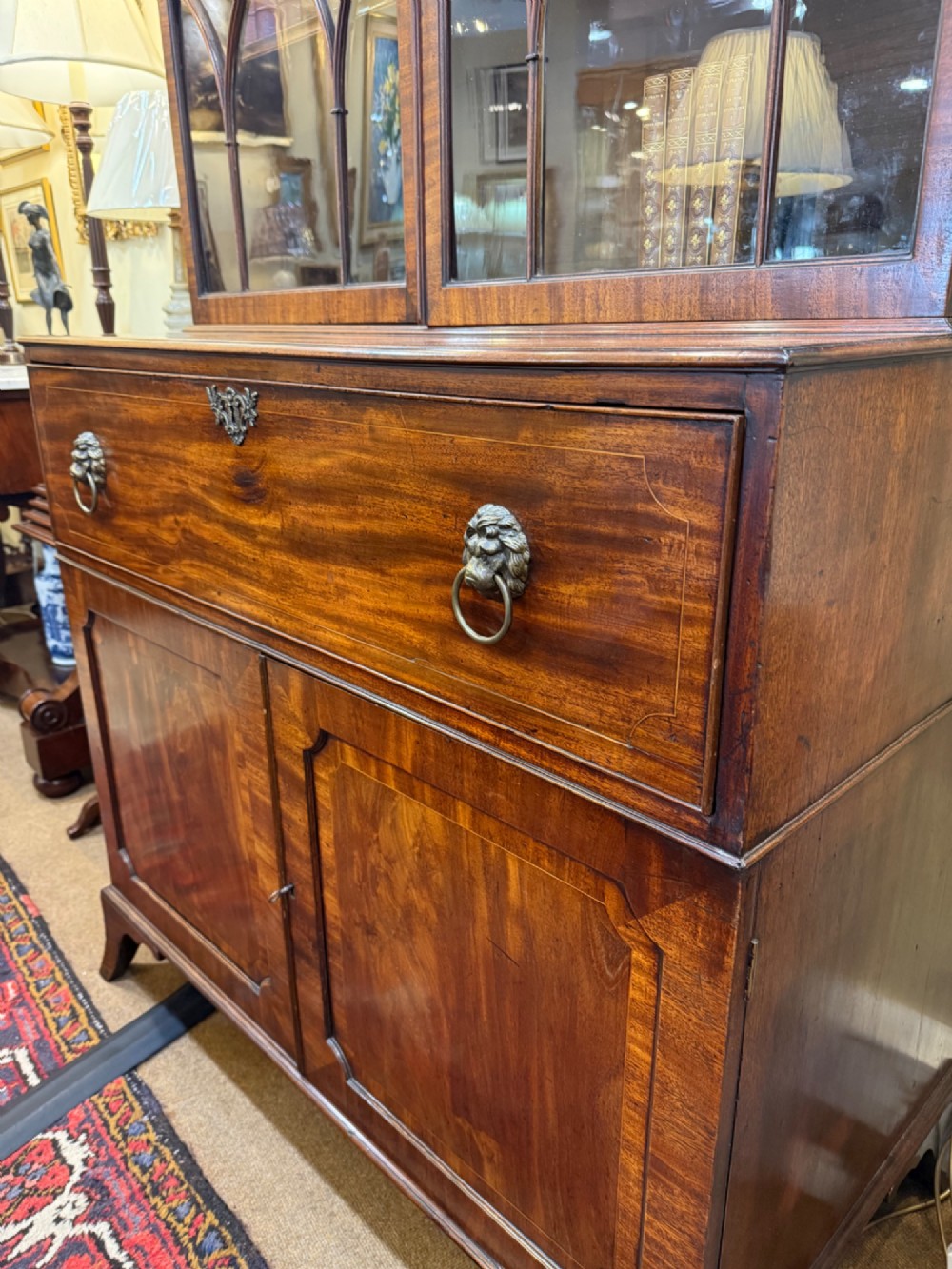 An 18th-century mahogany secretaire bookcase featuring a swan-neck pediment, astragal glazed upper doors, and a fall-front drawer above double doors. View II