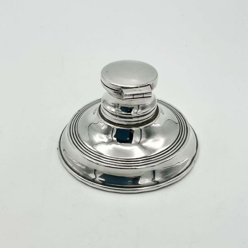 fig 2. An antique circular sterling silver capstan inkwell with a open hinged lid and visible British hallmarks.