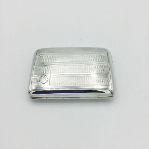 fig 1. A rectangular 1930s Art Deco sterling silver case decorated with engine-turned linear patterns and a monogram cartouche.