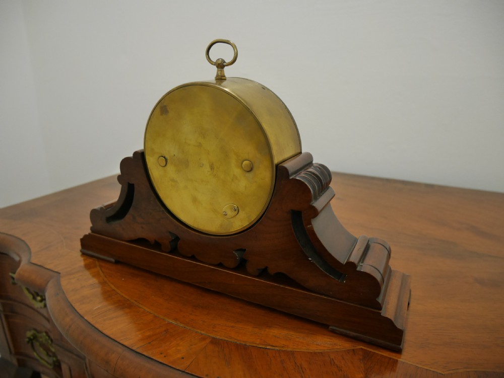 A mid-Victorian aneroid desk barometer mounted in a carved mahogany case on a stepped base with a brass dial bezel. View IV