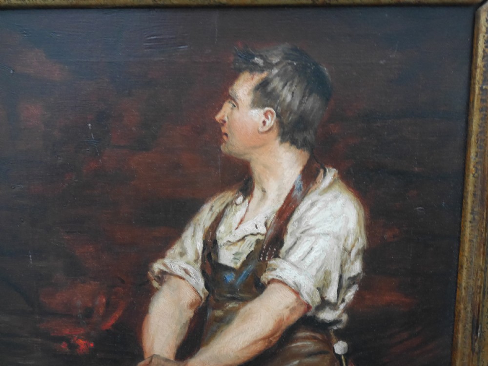 A framed oil painting depicting a blacksmith standing in profile inside a forge, holding a sledgehammer while wearing an apron, presented in a wide gilded frame. View V