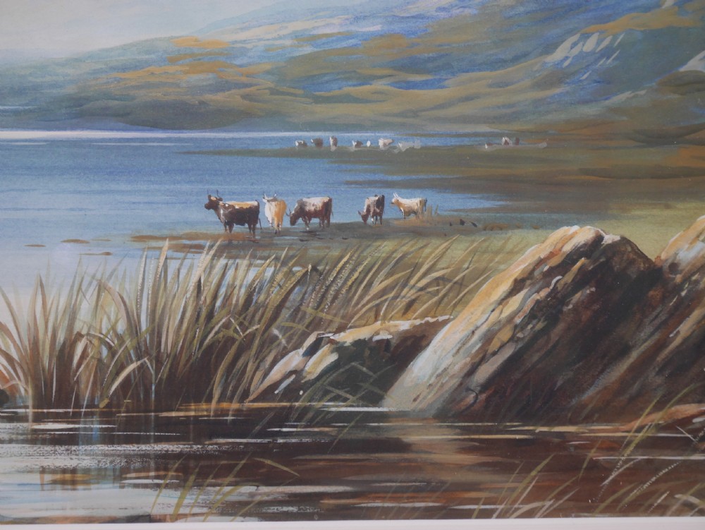A framed gouache landscape painting depicting a mountain lake scene with cattle near the water edge, set in a light timber frame. View IV