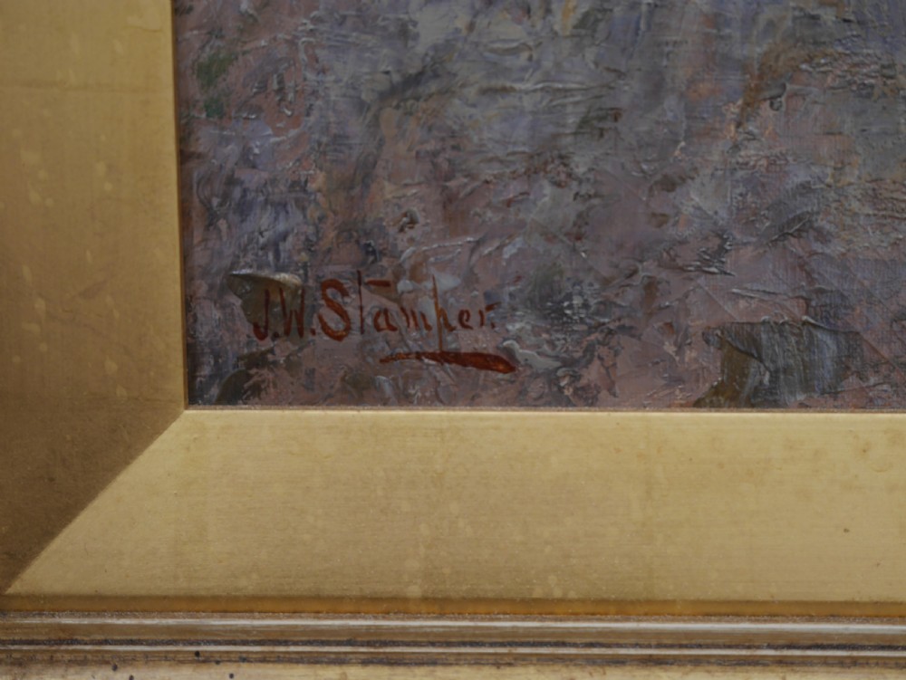 An antique oil painting on canvas depicting a rural stone cottage along a dirt path set in an ornate carved giltwood frame. View III