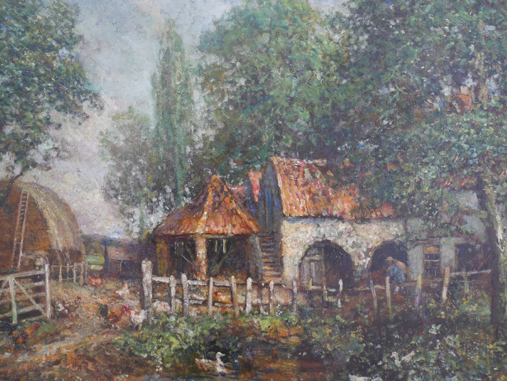 An impressionist oil painting on board depicting a rural farmyard scene with stone outbuildings, red tiled roofs, surrounding trees, and ducks near a pond in a slim gilt frame. View II