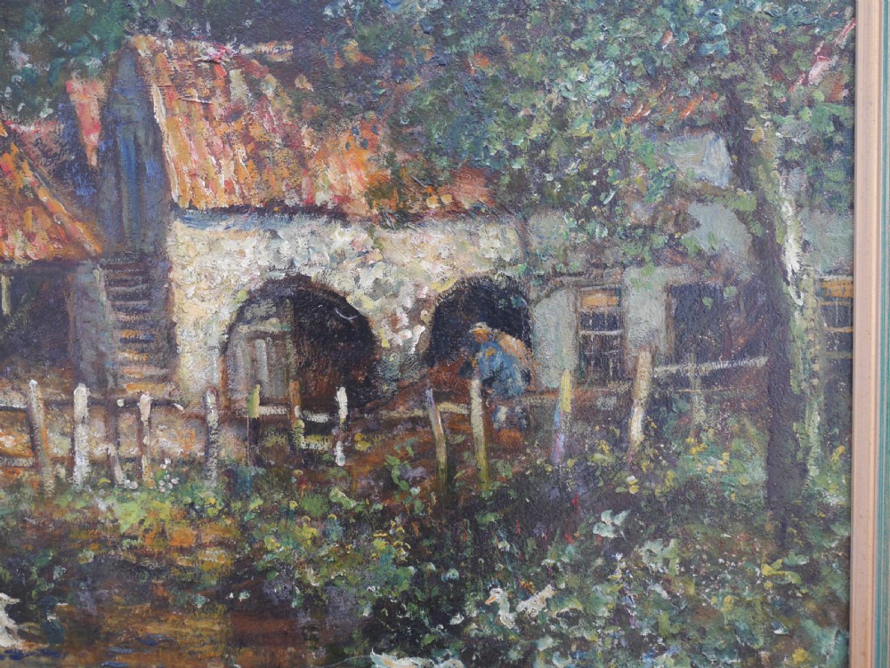 An impressionist oil painting on board depicting a rural farmyard scene with stone outbuildings, red tiled roofs, surrounding trees, and ducks near a pond in a slim gilt frame. View IV