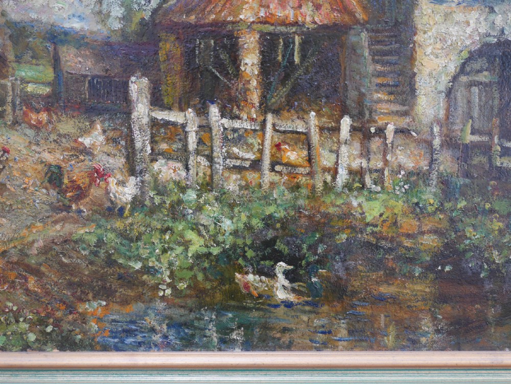 An impressionist oil painting on board depicting a rural farmyard scene with stone outbuildings, red tiled roofs, surrounding trees, and ducks near a pond in a slim gilt frame. View V