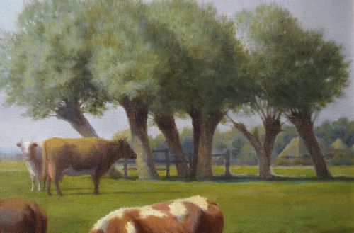fig 4. A gilded ornate frame enclosing an oil painting of cattle standing in a stream within a green pastoral landscape.