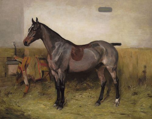 fig 1. An oil painting depicting a bay hunter standing in profile inside a straw-covered stable, set within an ornate carved gilt frame.