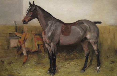 fig 2. An oil painting depicting a bay hunter standing in profile inside a straw-covered stable, set within an ornate carved gilt frame.