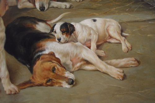 fig 5. An oil painting depicting several foxhound puppies and a fox terrier resting on a barn floor, set within a heavy carved gilded frame.