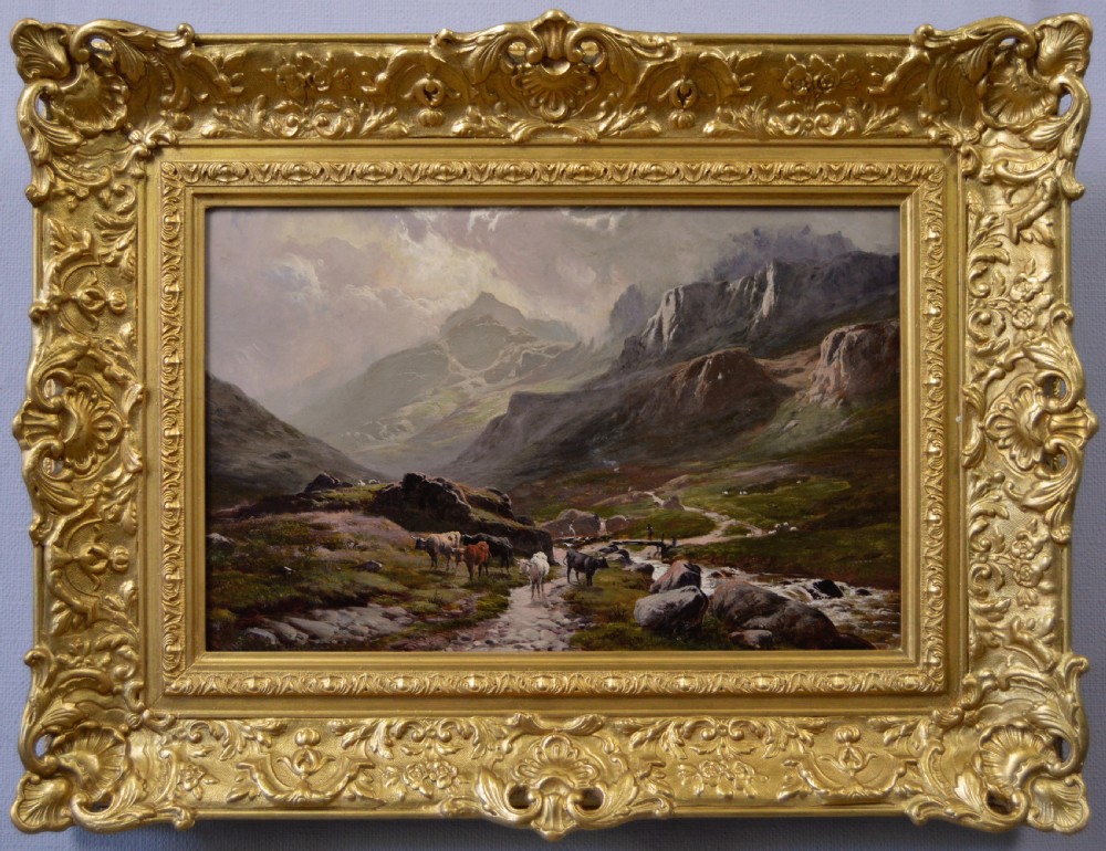 A nineteenth-century oil painting on canvas depicting cattle walking along a rocky path near Grizedale Pike, housed in an ornate carved gold frame.