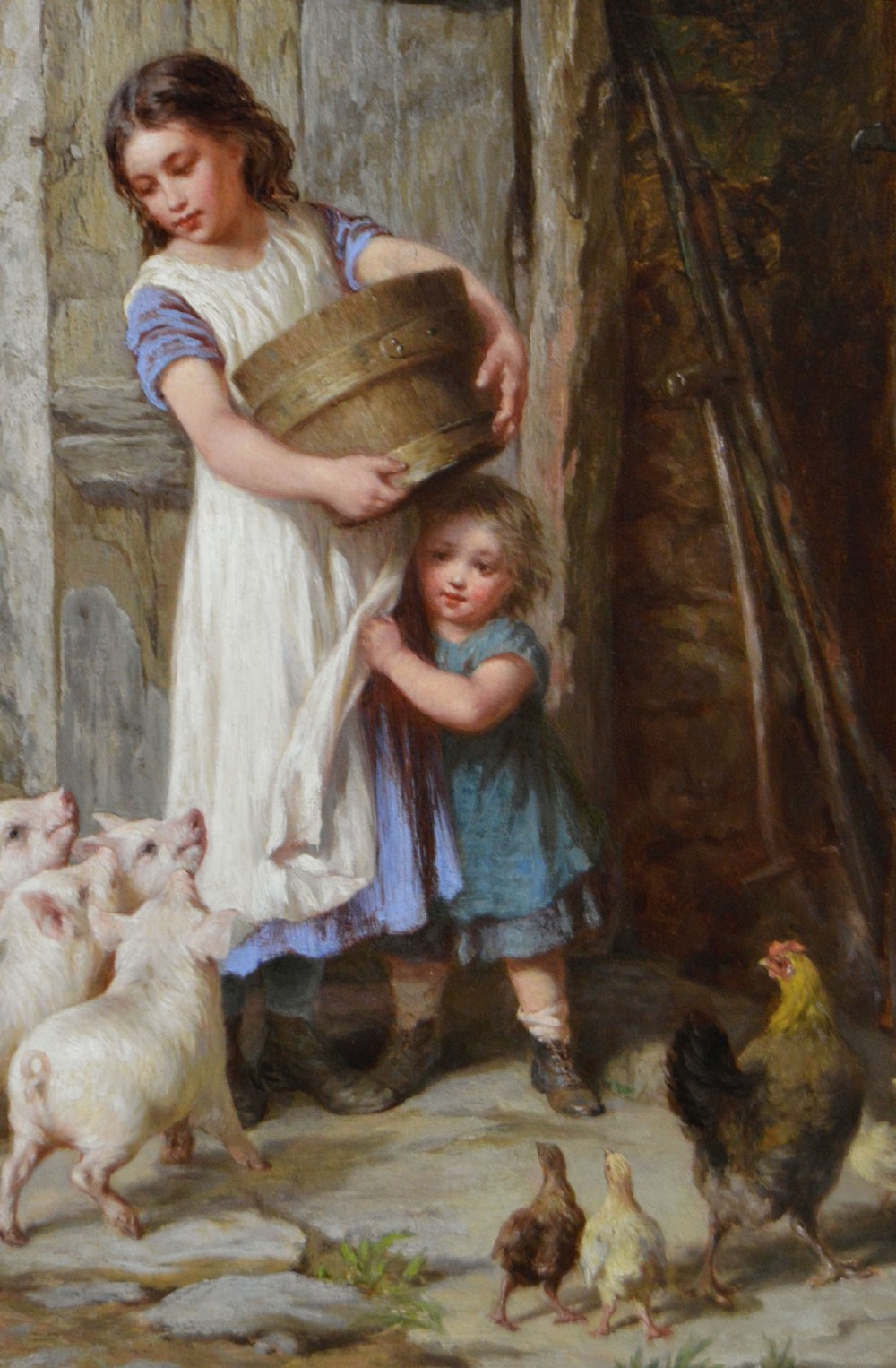 Victorian genre oil painting depicting two children feeding farmyard piglets and poultry beside a stone barn, set in a carved gilt frame. View III
