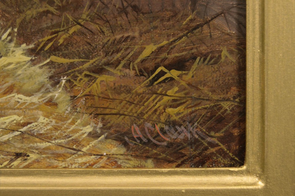 An oil painting of a brown bay racehorse standing in a straw-filled stable stall set within an ornate gold gilt frame. View V