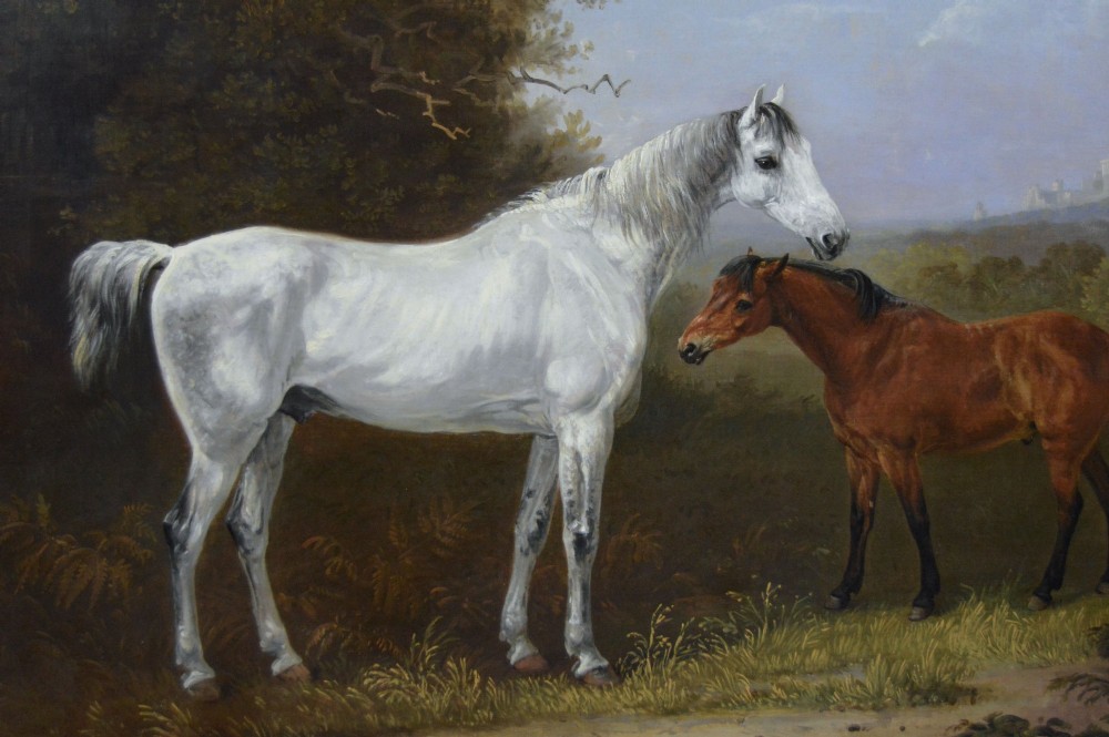 A 19th-century oil painting depicting a grey mare and a bay foal standing in a rural landscape with Windsor Castle in the distance, set within a beaded gold frame. View III