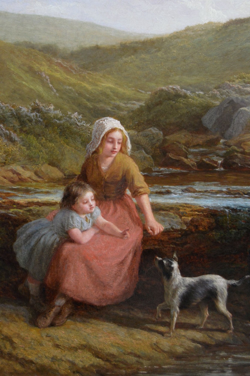 Victorian oil painting depicting a woman, young girl, and dog seated beside a moorland stream inside an ornate gilded gesso frame. View III