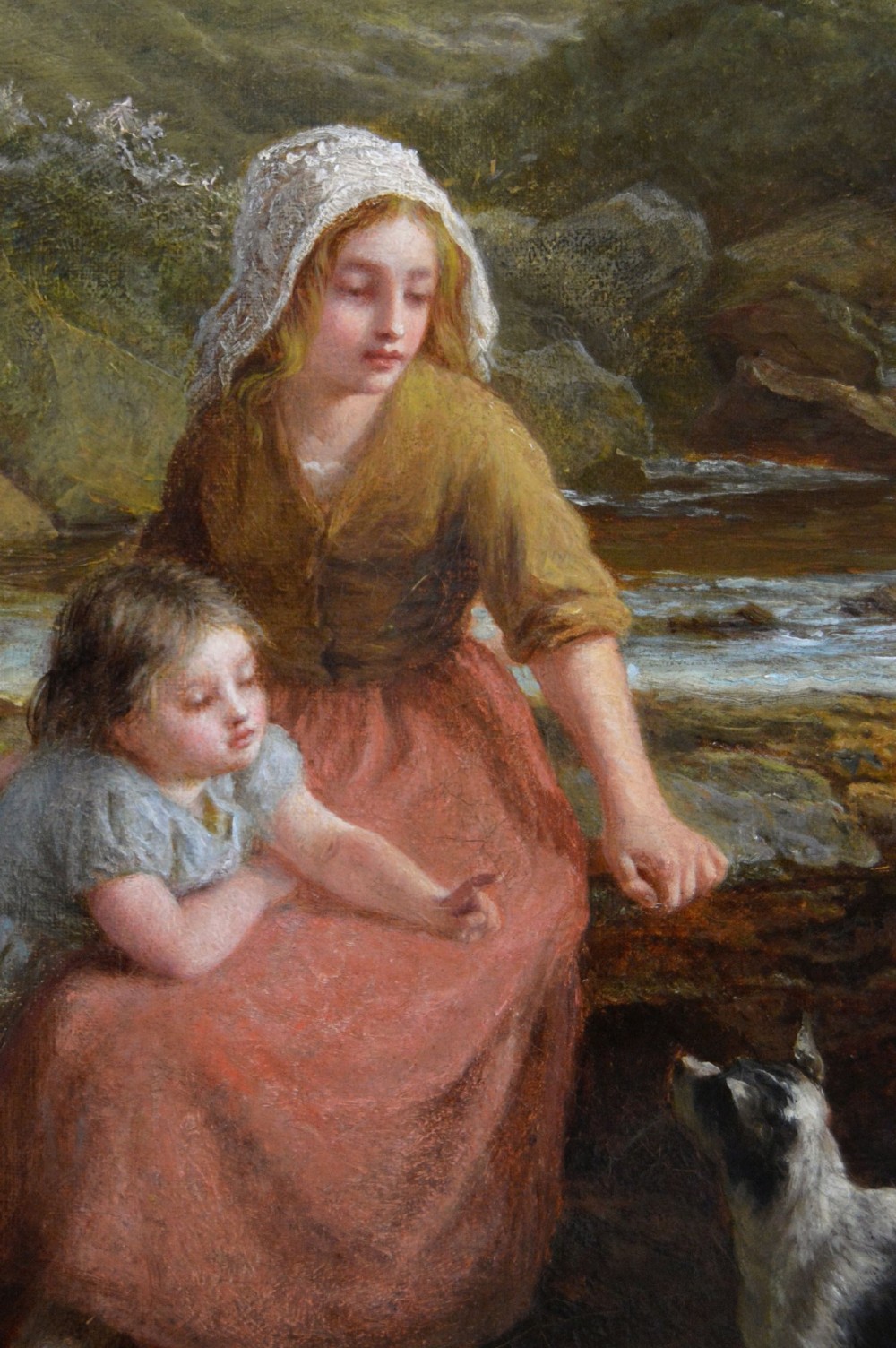 Victorian oil painting depicting a woman, young girl, and dog seated beside a moorland stream inside an ornate gilded gesso frame. View IV