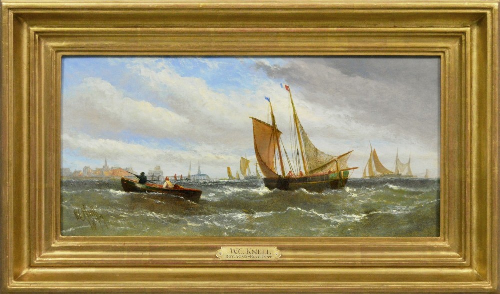 A Victorian maritime oil painting depicting sailing vessels and a small rowboat on choppy coastal waters set within a moulded gilt frame.