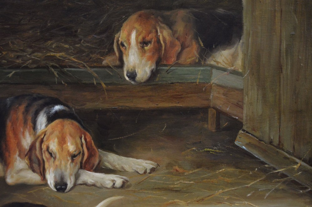 An oil painting depicting several foxhound puppies and a fox terrier resting on a barn floor, set within a heavy carved gilded frame. View VIII