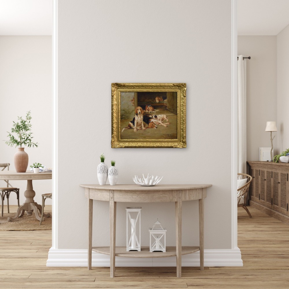 An oil painting depicting several foxhound puppies and a fox terrier resting on a barn floor, set within a heavy carved gilded frame. View XIII