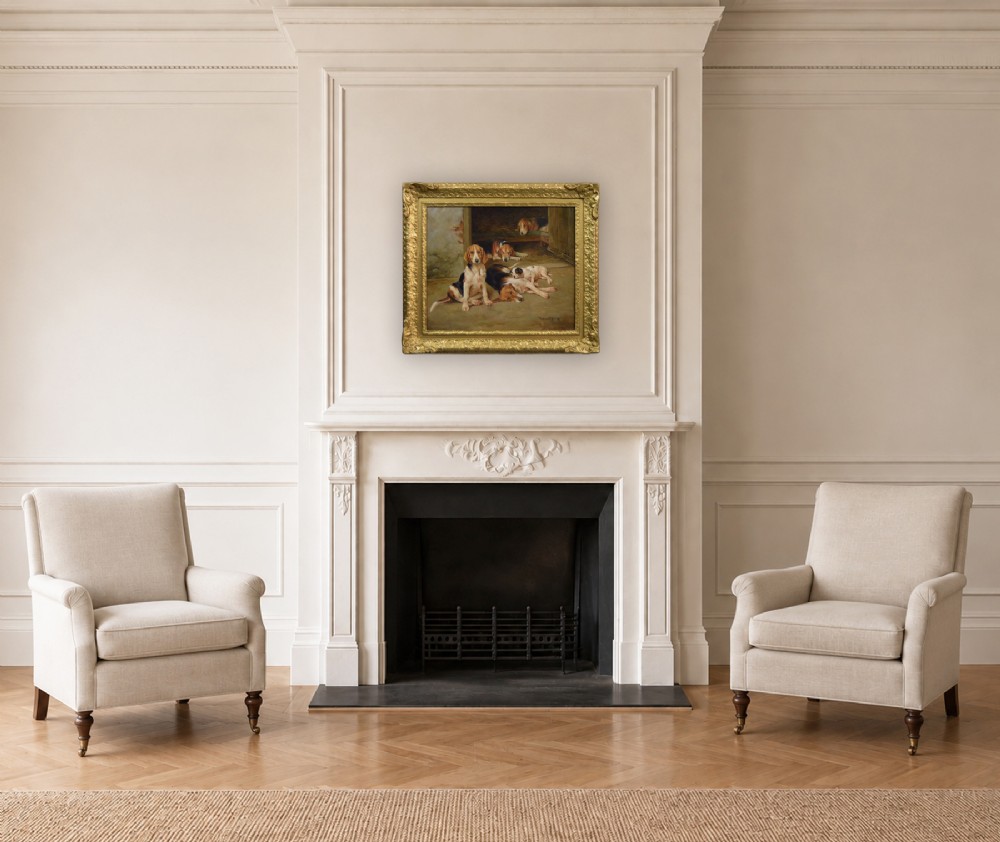 An oil painting depicting several foxhound puppies and a fox terrier resting on a barn floor, set within a heavy carved gilded frame. View XIV