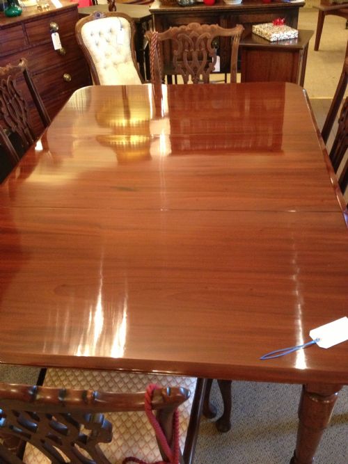 fig 1. Antique late Georgian six seater pull out dining table on turned legs in mahogany