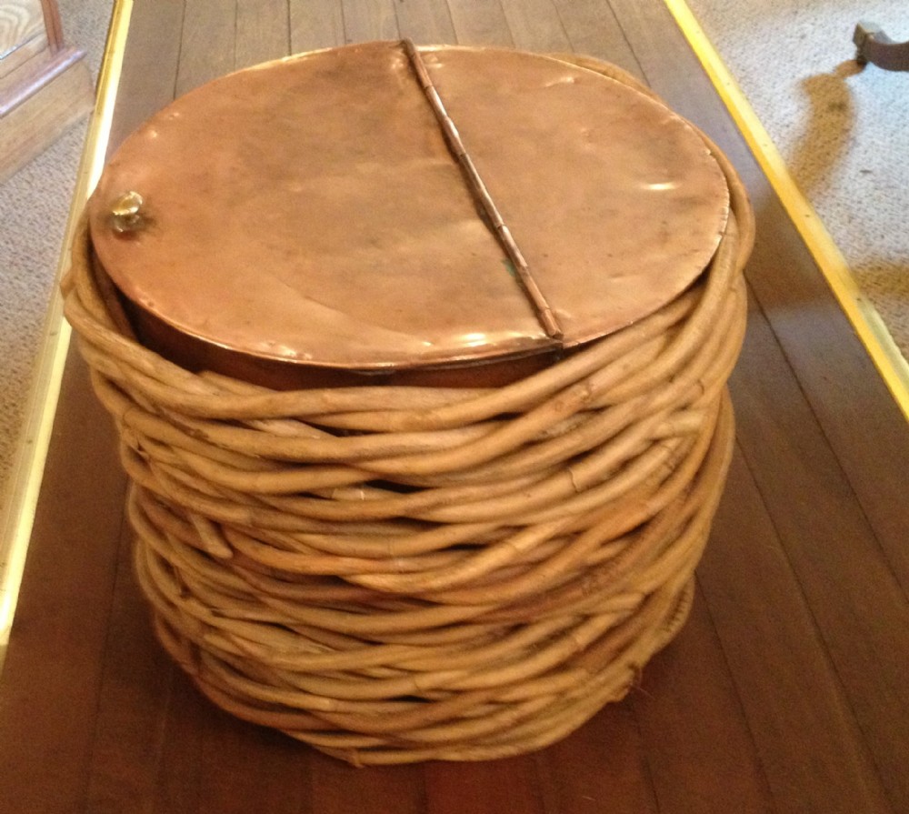 Victorian copper log bin in wicker basket