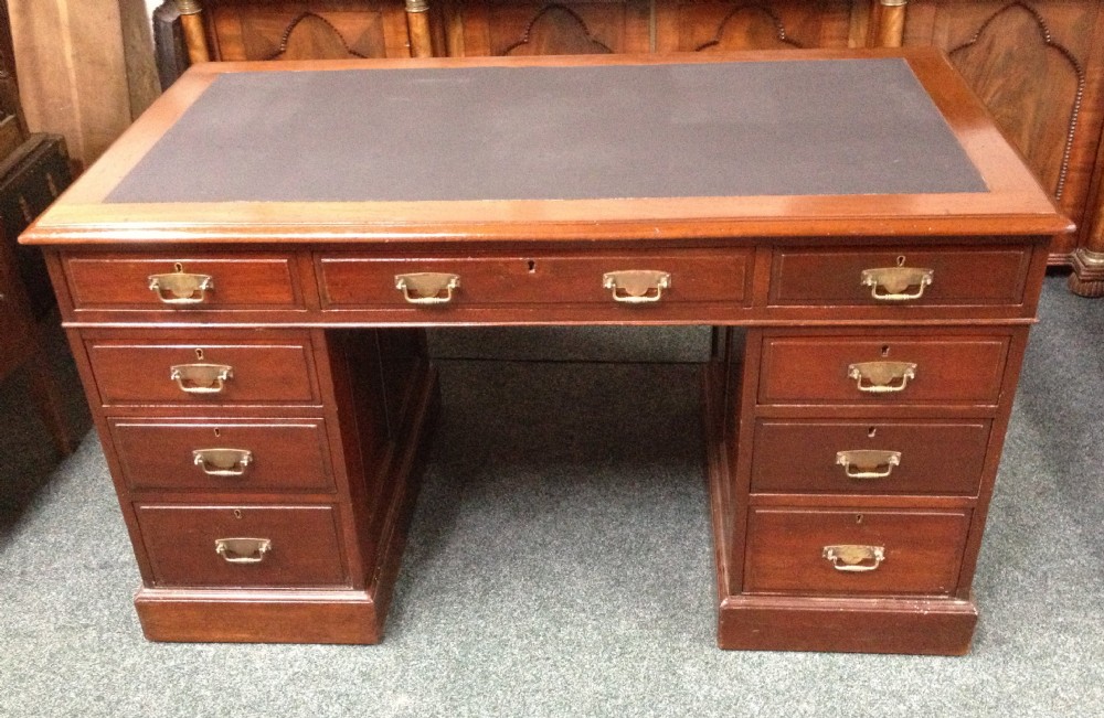 Antique Victorian twin pedestal solid mahogany desk with paneled sides and back circa 1880