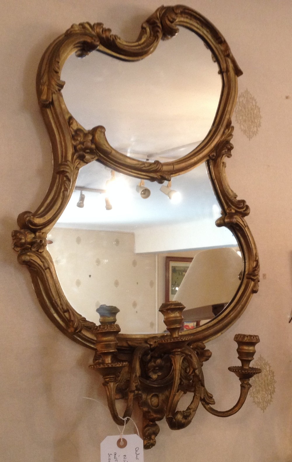 Antique nineteenth century gilt framed mirror with candle sconces. 