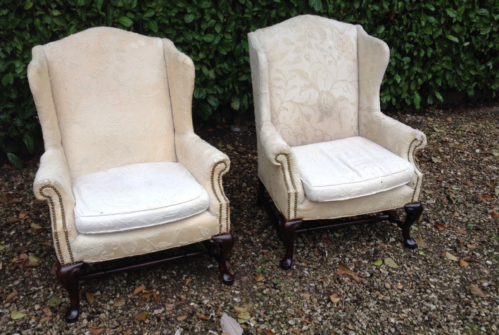 Pair of matched winged armchairs circa 1920 in need of reupholstery