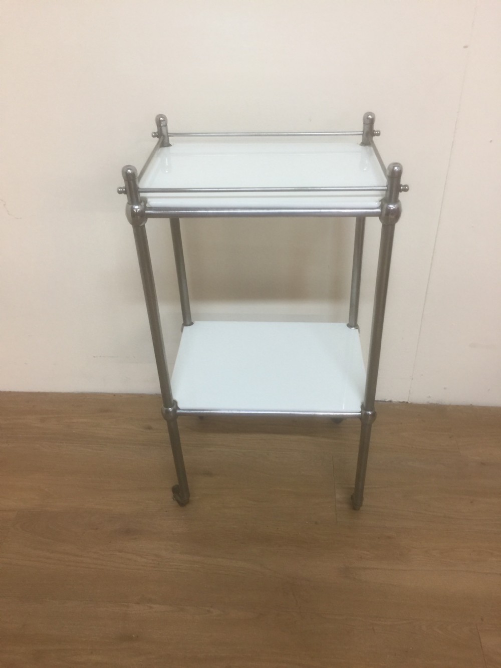 Chrome and opaline glass dental trolley.