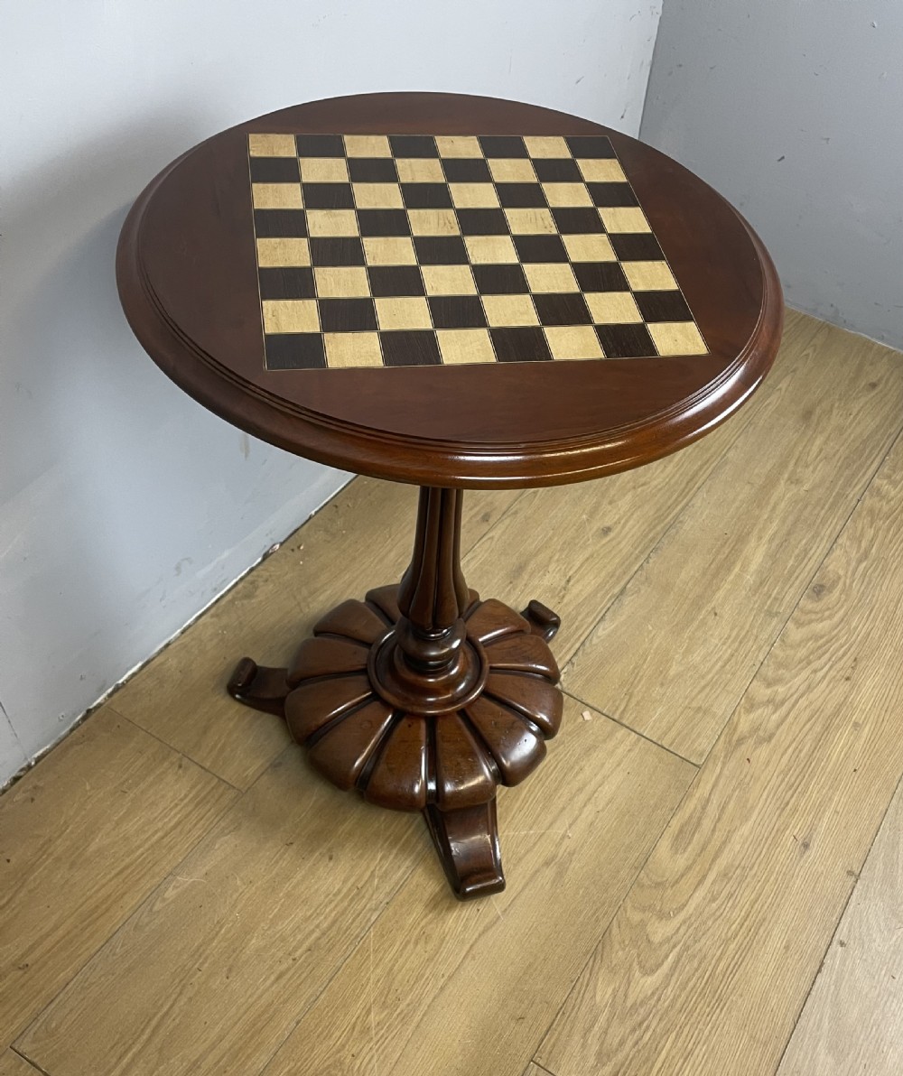 C19TH walnut games table on a carved base  View II