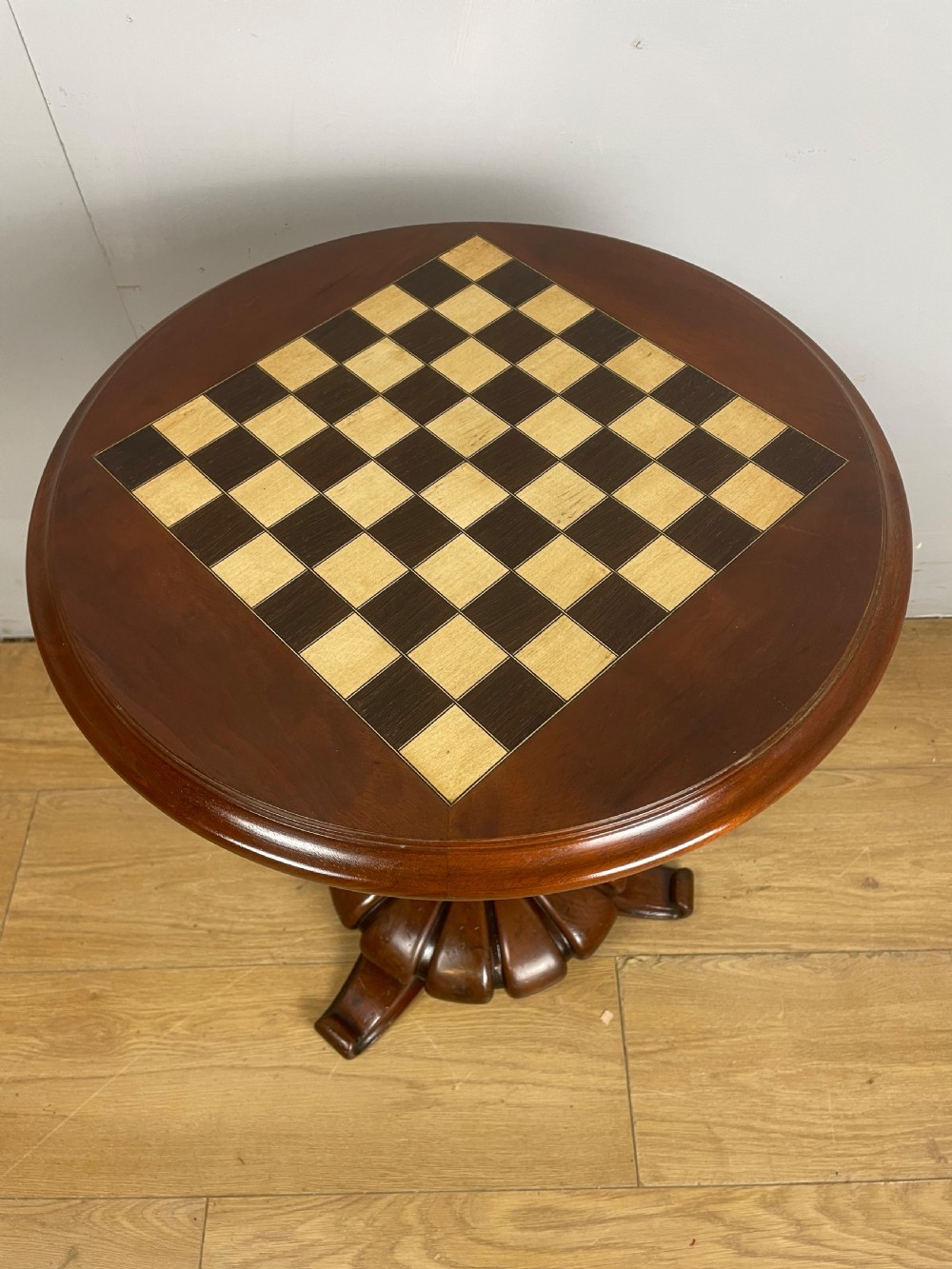 C19TH walnut games table on a carved base  View III