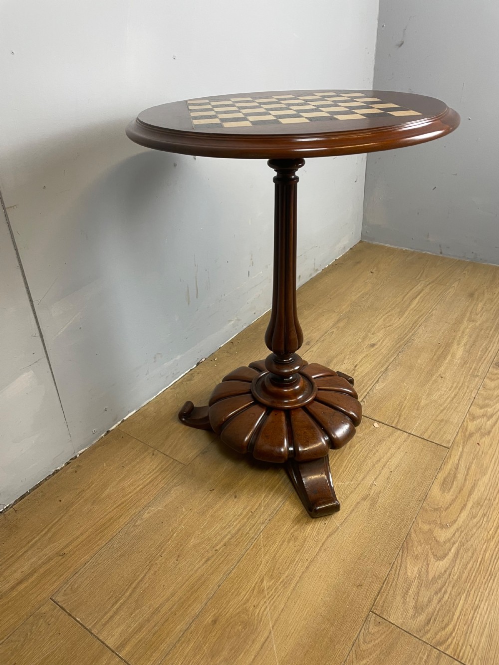 C19TH walnut games table on a carved base  View IV