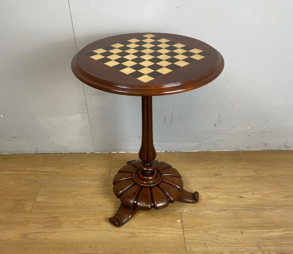 C19TH walnut games table on a carved base  View VII