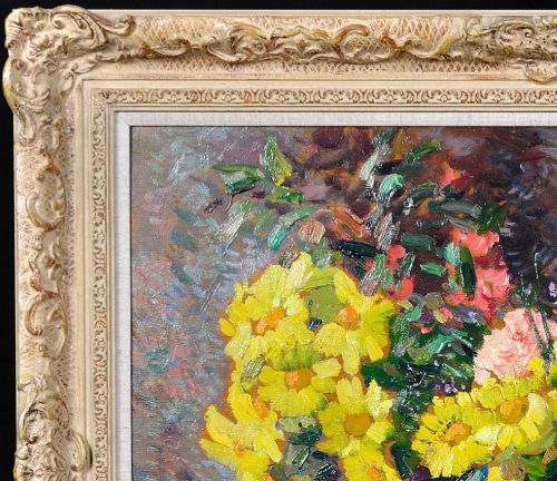 fig 4. Framed French oil painting depicting a floral still life arrangement of yellow marigolds and red carnations in a dark pedestal vase.