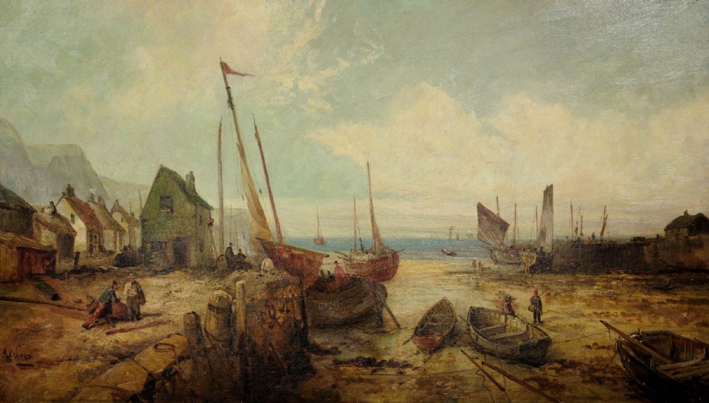 A nineteenth-century framed oil painting depicting fishing boats docked at a harbour shore beside coastal buildings, encased in a decorative gold leaf frame. View II