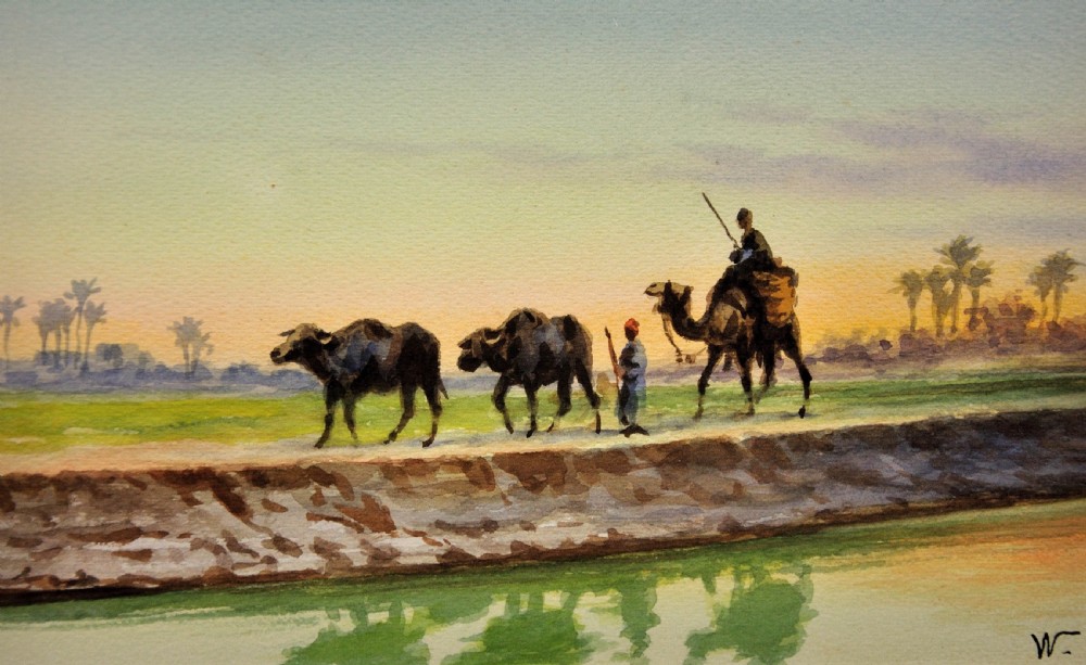 A framed watercolour painting depicting Egyptian farmers leading livestock and a rider on a camel along a canal bank at sunset. View II